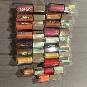 Fenty Beauty Gloss Collection with Pink, Red, and Gold Shades